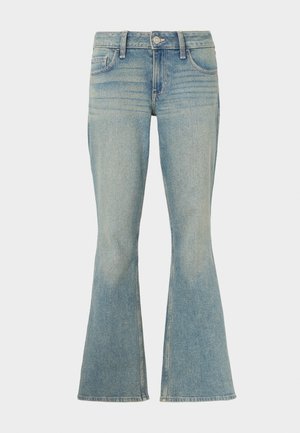 Lys blå vide jeans laget av denim med en falmet finish, fem lommer og glidelås med knappelukking.