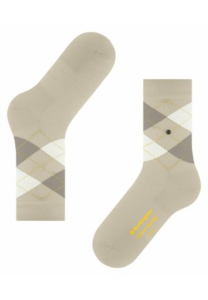 Beige sokken met een diamanten patroon in lichtgrijs, donkergrijs en wit, met gele stiksels. Inclusief merlogo in het geel op de zool.