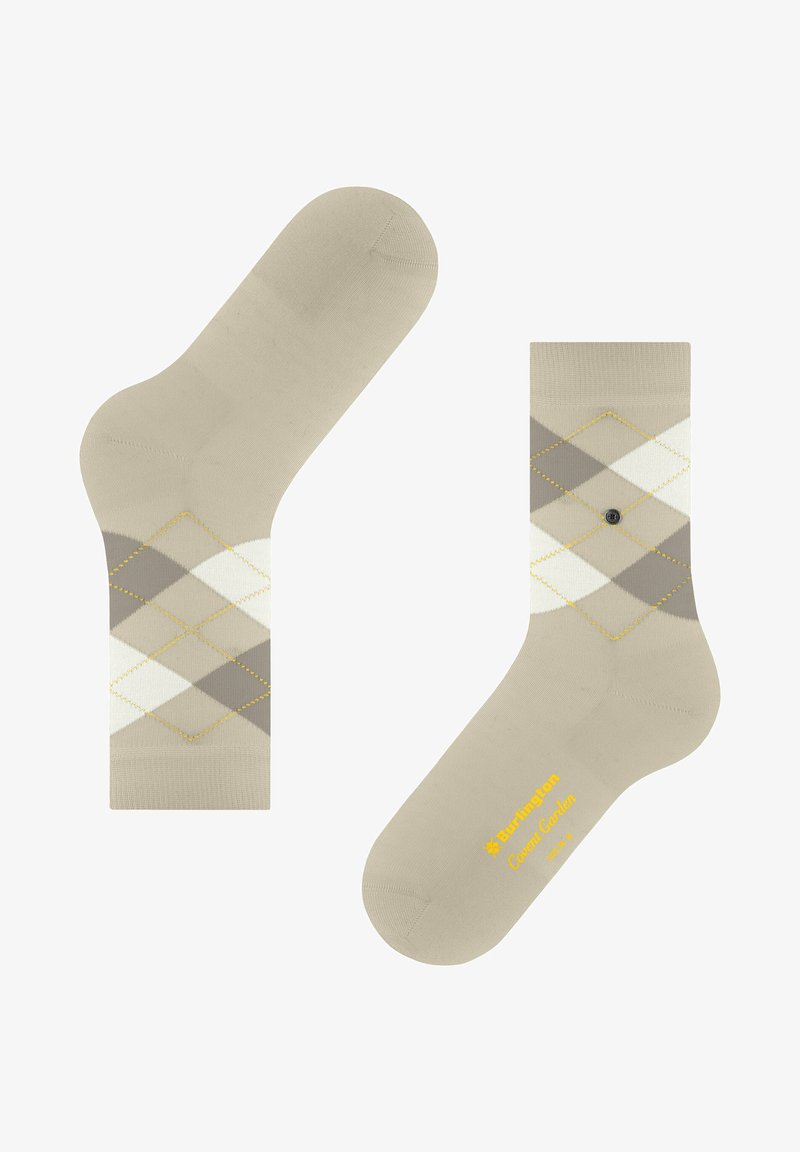 Beżowe skarpetki z wzorem w diamenty w jasnoszarym, ciemnoszarym i białym kolorze z żółtymi przeszyciami. Zawierają logo marki w żółtym kolorze na podeszwie.