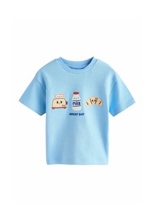 Light blue cotton t-shirt with short sleeves. Features embroidered designs of toast, milk bottle, and croissant. Text reads "GREAT DAY."