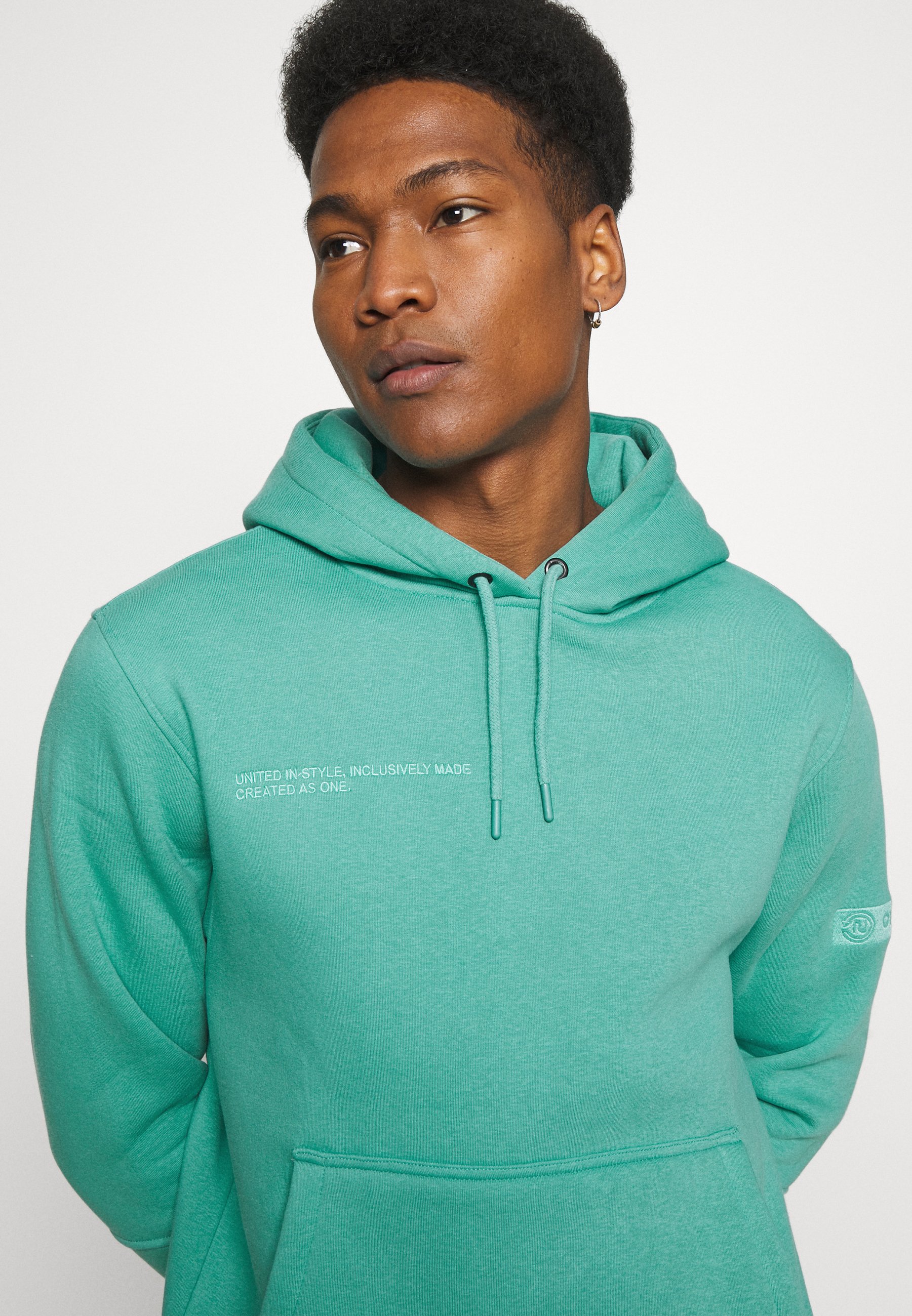 turquoise sweatshirt
