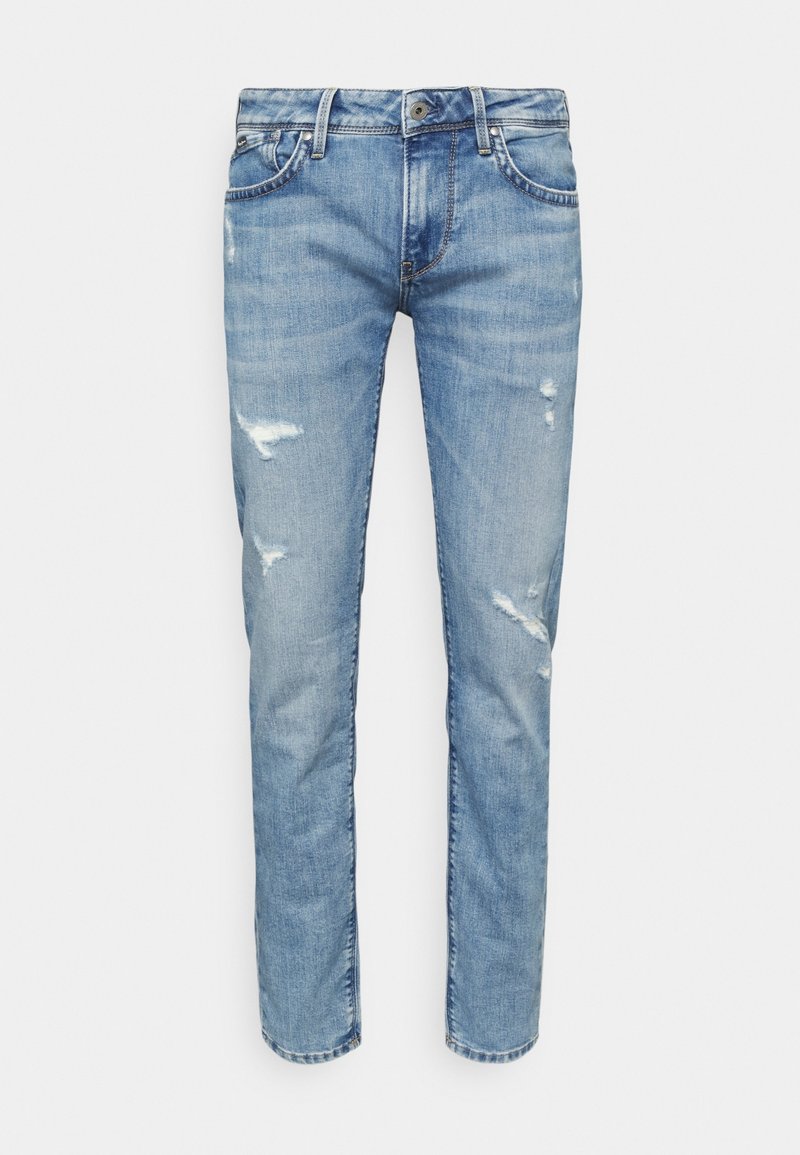 Vaaleansiniset farkut, joissa on kapea malli, viiltoja ja viisi taskua. Kangas on sileä ja hieman joustava.