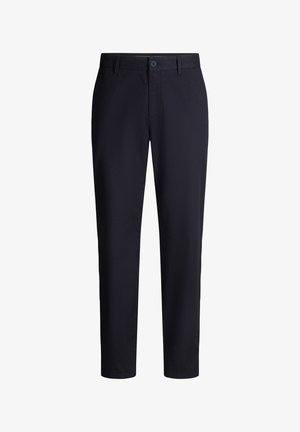 Marineblauwe slim-fit broek met riemlussen, knoopsluiting aan de voorkant en voorzakken, afgebeeld tegen een witte achtergrond.