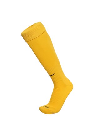 Żółta skarpetka sięgająca do kolan, wykonana z gładkiego materiału z prążkowaną teksturą na górze. Posiada czarny nadruk logo w okolicy kostki.