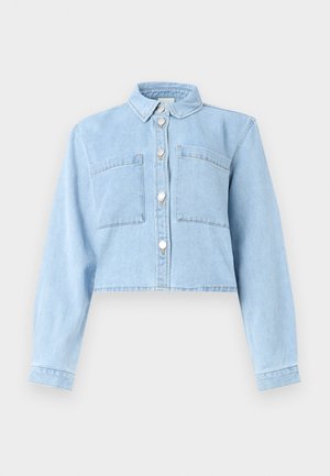 Light blue denim cropped jacket with long sleeves, button placket, and two chest pockets. It features a classic collar and soft texture.