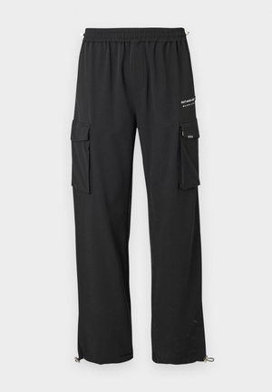 Black cargo pants with an elastic waistband, two side pockets, zippered pockets on legs, and adjustable hems with toggles.