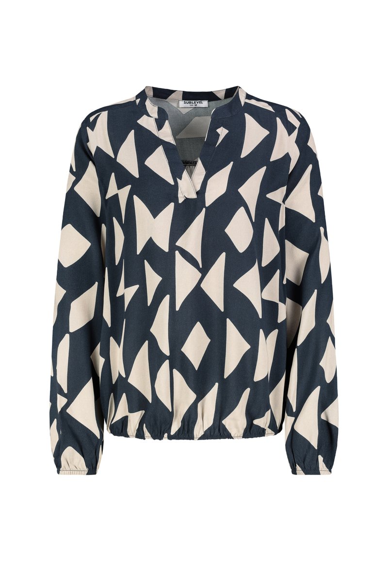 Marineblaue Bluse mit abstraktem cremefarbenem Muster, V-Ausschnitt, langen Ärmeln und elastischem Saum. Glatte Stofftextur.