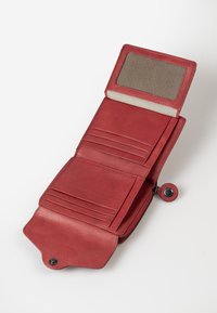 Red leather wallet with a fold-over design, featuring multiple card slots, a mesh ID window, and a zipper closure. Smooth texture.