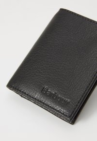 Black leather wallet with a textured finish, featuring a subtle embossed brand name, and neat stitching along the edges.