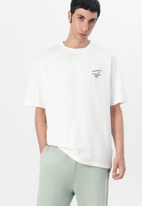 ARKK Copenhagen BOXY TEE UNISEX - Apdrukāts T-krekls - off white