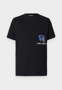 Black cotton t-shirt featuring a chest graphic of a face with sunglasses, accompanied by the text "KARL LAGERFELD" below. Short sleeves and crew neck.