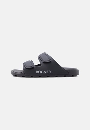 Sandale à glissière noire avec deux brides réglables et semelle épaisse, avec le logo "BOGNER" sur le côté.