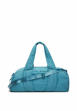 Blauwe gewatteerde reistas met twee korte handgrepen en een verstelbare schouderriem, afgebeeld tegen een witte achtergrond.