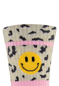 Skarpetki do kolan z jasnoszarym tłem, w Print w panterkę, różowymi paskami i dużą żółtą buźką na środku. Wykonane z mieszanki bawełny.