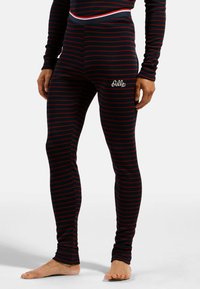Schwarz-rot gestreifte Leggings mit einer engen Passform. Verfügt über einen elastischen Bund und ein kleines weißes besticktes Logo am Oberschenkel.