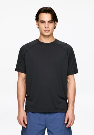 Black short-sleeve t-shirt with a round neck and raglan sleeves, made from a smooth, lightweight fabric. Minimal seams and simple design.