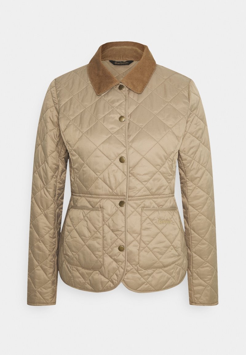 Veste matelassée beige avec col en velours côtelé marron, boutons pression sur le devant, deux poches avant et taille cintrée.