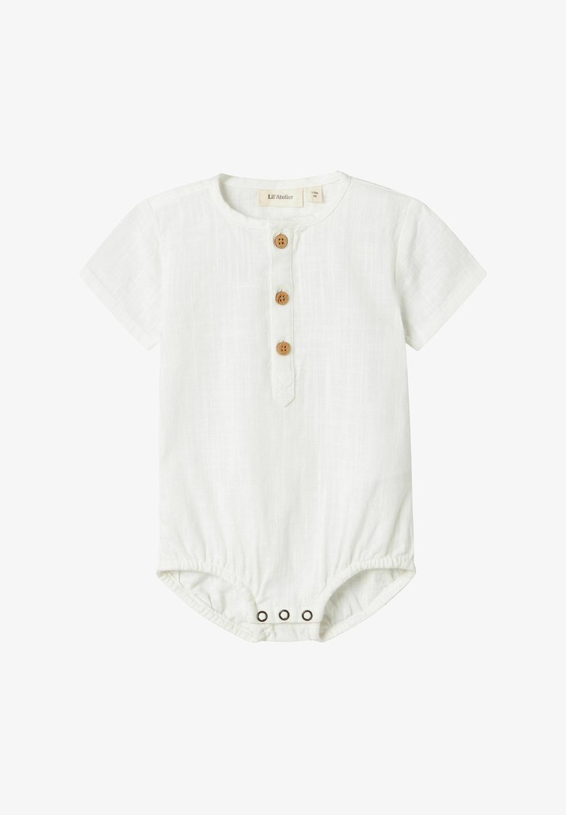 Trumpetėlė su trumpomis rankovėmis, pagaminta iš lengvo audinio, priekyje su trimis mediniais mygtukais ir snapelių užsegimais apačioje.