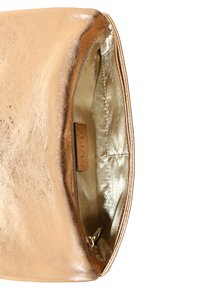 Gold metallic clutch bag with a smooth, shiny exterior. Lined with a soft, shiny gold interior. Features a subtle brand label inside.