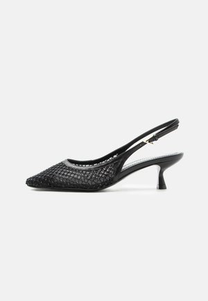 Black slingback kitten heel shoe with pointed toe, mesh and beaded upper, and slim ankle strap with gold buckle.