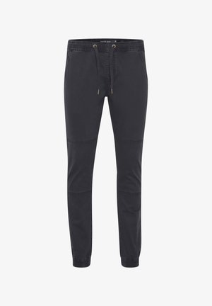 Schwarze Jogginghose aus einem Baumwollmischgewebe, mit einem elastischen Bund und Kordelzug, tapered Beinen und seitlichen Taschen.