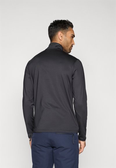 Černý top s dlouhým rukávem a vysokým límcem, vyrobený z hladké látky, s úzkým střihem a zipem na spodní části zad.