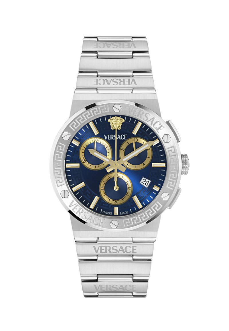 Silver stainless steel watch with a blue dial, gold accents, three sub-dials, and embossed Versace logo. Features a patterned bezel and bracelet.