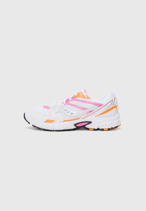 White athletic shoe with pink, orange, and black accents. Features breathable mesh upper, padded collar, and textured sole.