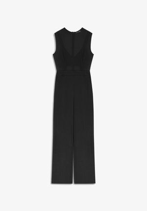 Combinaison noire sans manches avec dos en filet, jambes larges ajustées, passants de ceinture et col montant avec une fermeture éclair dissimulée.