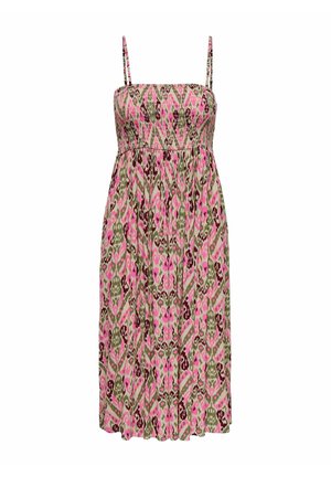 Õlavarretu kleit lillemustris, kus on roosa, roheline ja pruuni tooni, millel on keha lähedalt istuv ülaosa ja voogav seelik.