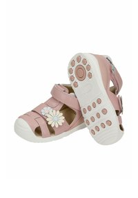 Sandales roses pour tout-petits avec semelles en caoutchouc blanches, décorations florales sur les brides et fermetures Velcro, vues de côté et de la semelle.