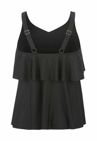 Musta hihaton toppi, jossa on kerrostettu röyhelömuotoilu edessä, säädettävät olkaimet ja sileä pinta, joka istuu rentosti.