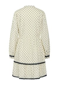 Cremfarbenes Kleid mit maritimem Blumenmuster, langen Ärmeln, geraffter Taille und Spitze am Saum und an den Ärmeln. Leichter Stoff mit weicher Textur.