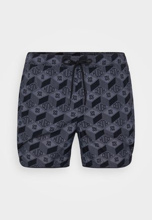 Navy swim shorts featuring a geometric pattern in black and gray, with an elastic waistband and drawstring, made from lightweight fabric.