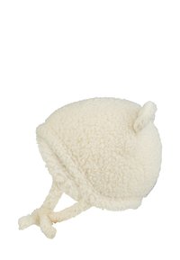 Cream-colored fleece hat with rounded shape, textured fabric, two small ear-like accents, and ties for secure fit.