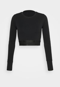 Czarny, krótki top z długim rękawem wykonany z gładkiej tkaniny, z okrągłym dekoltem i elastyczną taśmą z nadrukowanym logo na dole.