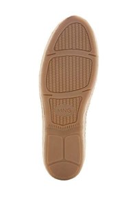 Light brown rubber shoe sole with textured surface and circular patterns, branded with "MNG" in the center.