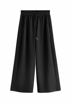 Schwarze, weite, cropped Hosen mit elastischem Bund und verstellbarem Kordelzug, ausgestattet mit seitlichen Taschen und einem lockeren Schnitt.