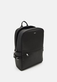 Black backpack made of smooth synthetic material, featuring a rectangular design, zippers, front pocket, and a logo on the front.