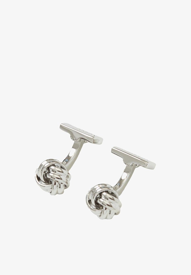 Srebrne spinki do mankietów z motywem węzła, z polerowanym wykończeniem i zapięciem t-bar. Gładka tekstura i zaokrąglony kształt.