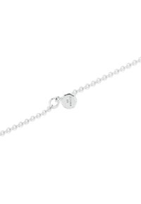 Sterling silver chain bracelet featuring small round links, secure lobster clasp, and circular tag engraved with "925."