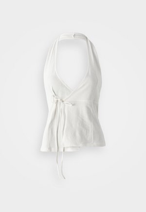 White halter top made of soft fabric. Features a deep V-neck, wrap design, and adjustable tie at the waist. Smooth texture, casual style.