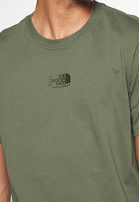The North Face Camiseta estampada - khaki