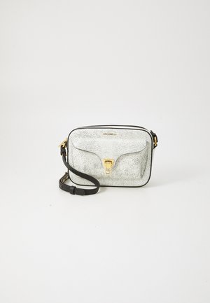 Crossbody bag with a white cracked leather exterior, gold hardware, zip closure, and a black strap. Compact rectangular design.