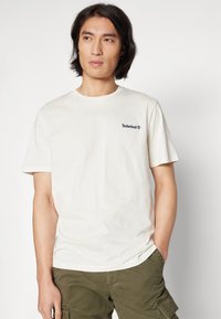 Timberland SMALL LINEAR LOGO PRINT TEE - T-shirts med print - vintage white