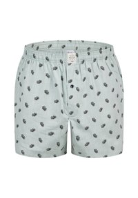 Světle modré bavlněné boxerky s černým listovým vzorem, s elastickým pasem a zapínáním na knoflík v přední části.