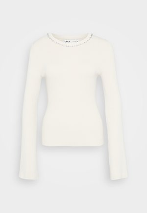 Ribbed white long-sleeve sweater with a fitted silhouette and embellished neckline featuring small clear gems along the collar.