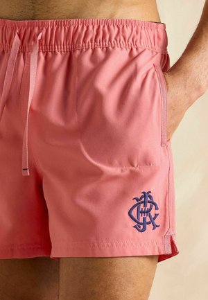 Ružové plavky vyrobené z ľahkej textílie, s elastickým pásom, šnúrkou, bočnými vreckami a vyšitým námorníckym logom.