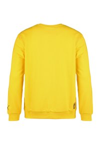 Żółta bluza z długim rękawem, okrągłym dekoltem, z prążkowanymi mankietami i dolną krawędzią, z małym logo umieszczonym w dolnej lewej części.