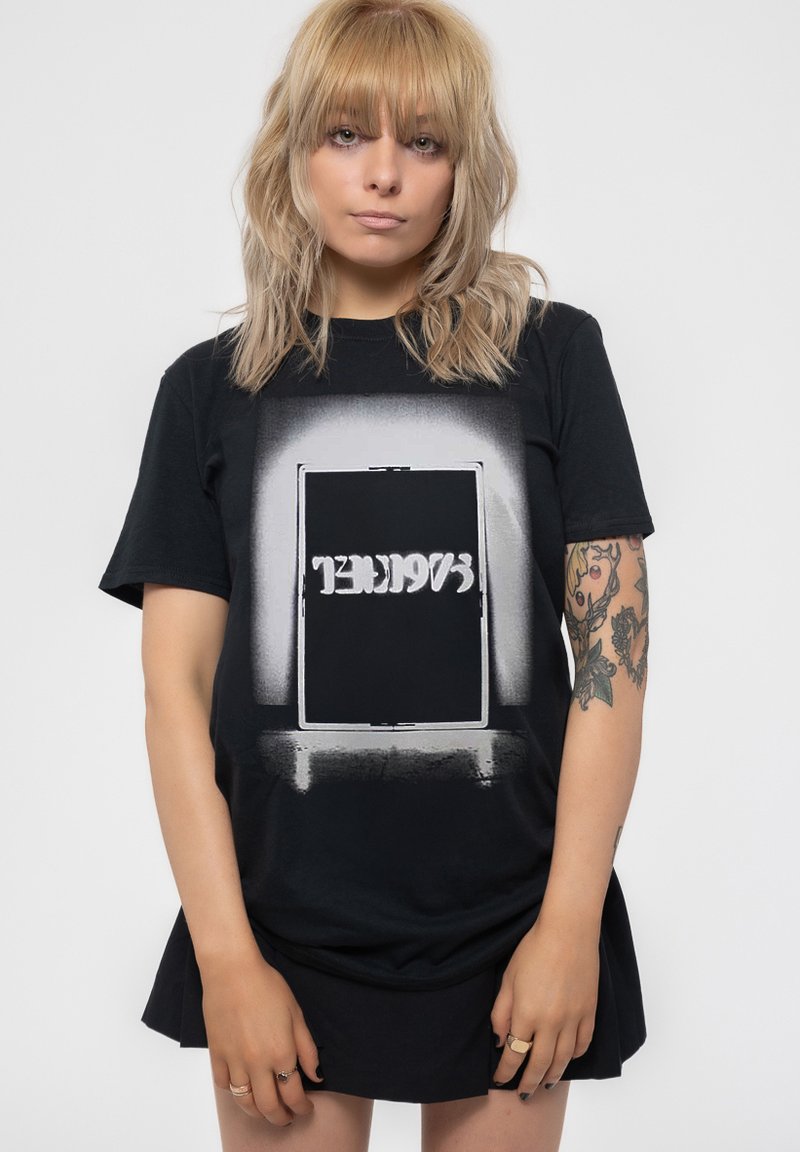 Black cotton t-shirt featuring a large graphic of a door with white accent text. The shirt has a relaxed fit and short sleeves.